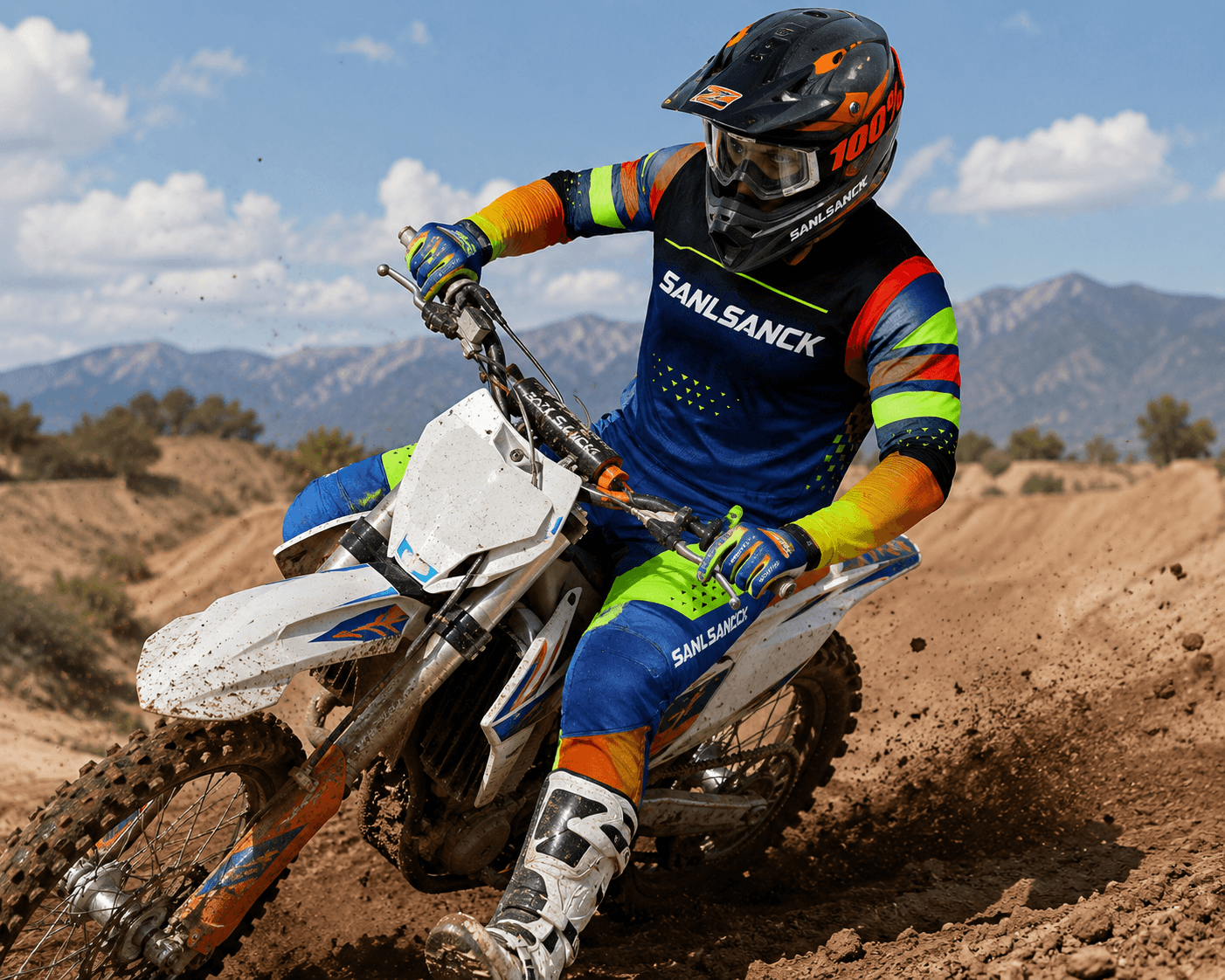 Custom blue orange and neon motocross racing jersey and pants worn by a dirt bike rider