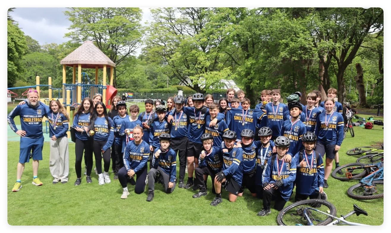 Portobello High Singletrack MTB Team celebrating together in custom jerseys
